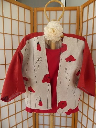 Kimono linen jacket. This poppies fabric was purchased in Helsinki. These jackets are loose fitting and will fit between size 10 - 16. You may like to wear a belt around this jacket to make it more fitted. $70.00