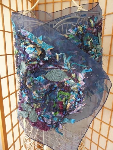 This scarf/wrap is uniquely made from personally selected complementary pieces of fabric which have sewn onto voile. It is one of a kind. It was featured in the Cervantes Art Show 2019. $80.00