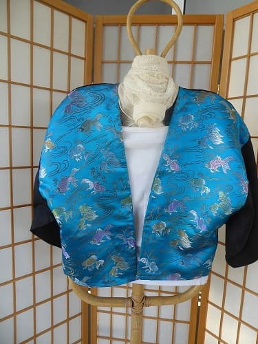 Kimono linen jacket. These jackets are loose fitting and will fit between size 10 - 16. You may like to wear a belt around this jacket to make it more fitted. $70.00